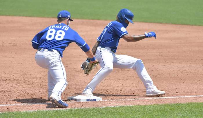 Jul 7, 2020; Kansas City, Missouri, United States; Kansas City Royals shortstop Adalberto Mondesi (27) is safe getting back to first base as first baseman Nick Pratto (88) attempts the tag during workouts at Kauffman Stadium. Mandatory Credit: Denny Medley-USA TODAY Sports